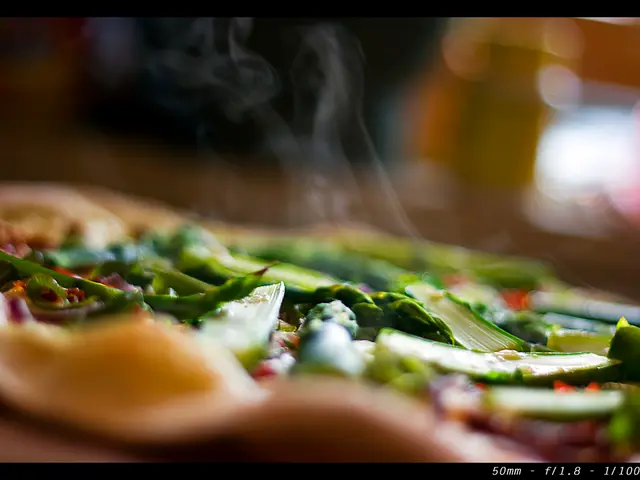 In this image I can see number of vegetables and the smoke. I can also see this image is little bit...