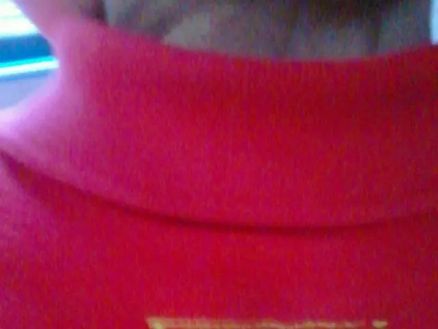 In the picture i can see a person wearing red color T-shirt.