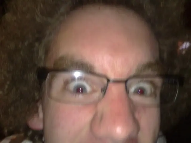 In this image I can see a person face and that person wore spectacles.